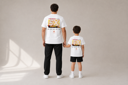 Adult and young child holding hands in adult and KIDS Champion Tees — studio mockup